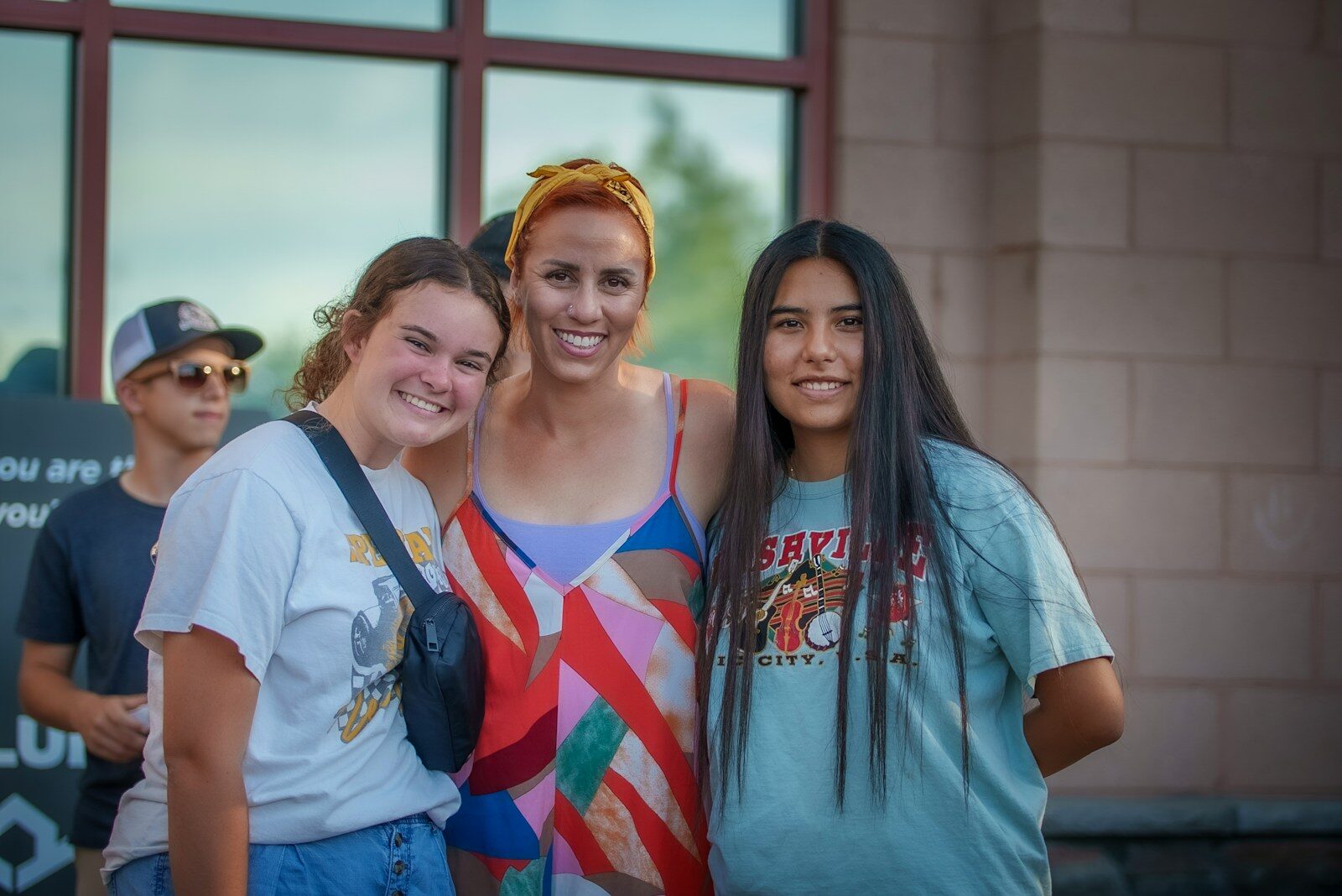a group of young women standing next to each other